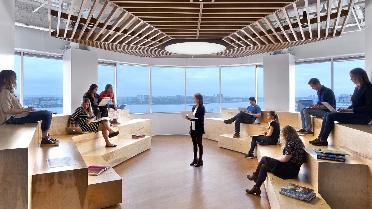 Unique meeting area design featuring a bleacher-style setting made from natural wood.