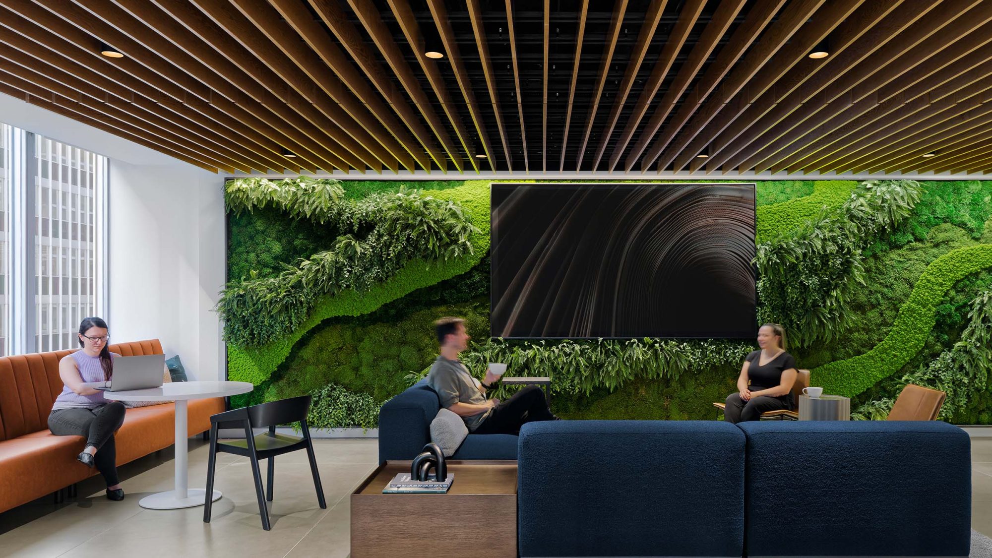 Work environment design featuring a living wall.