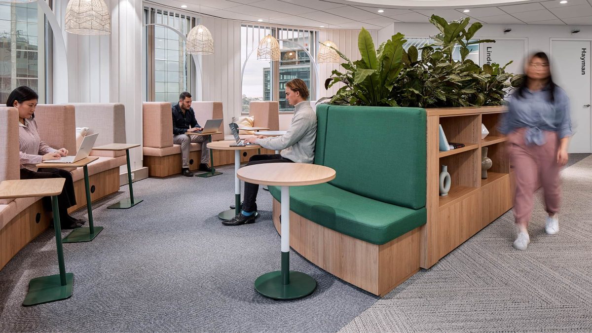 people working in open area in booths