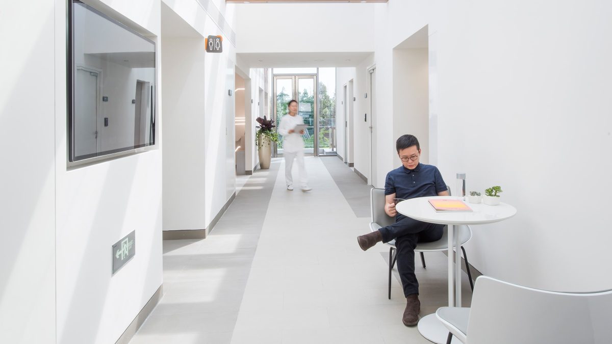 person waiting in corridor