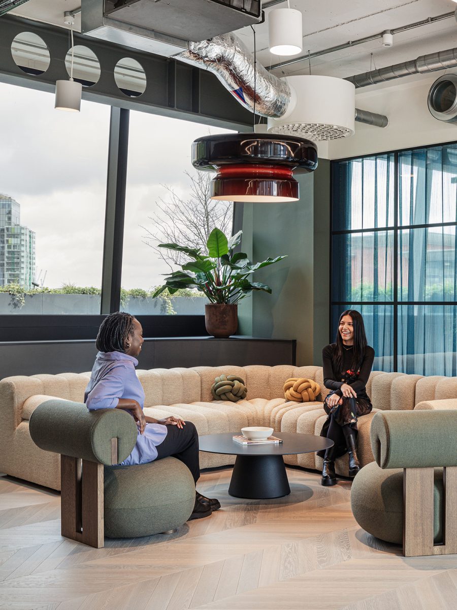 close-up-shot-of-two-people-chatting-on-sofas-at-wilson-sonsini-london-office