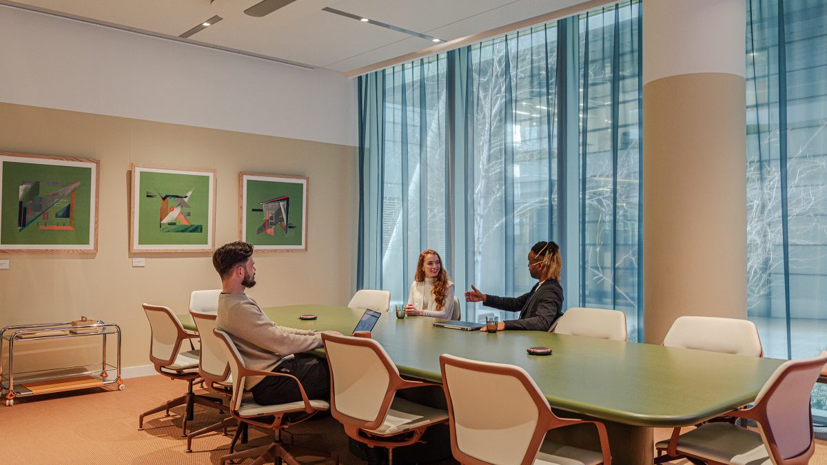people-communicating-at-large-boardroom-table-at-m-moser-london-studio