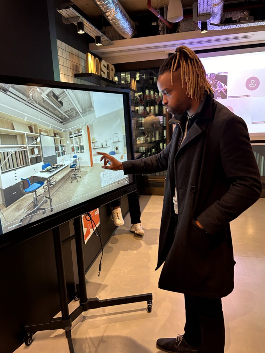 person-using-touch-screen-to-review-design-visual-for-moser-change strategy