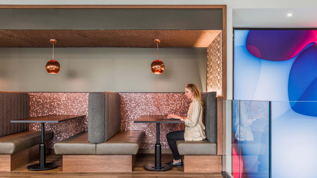workplace-design-booth-seating-woman-working