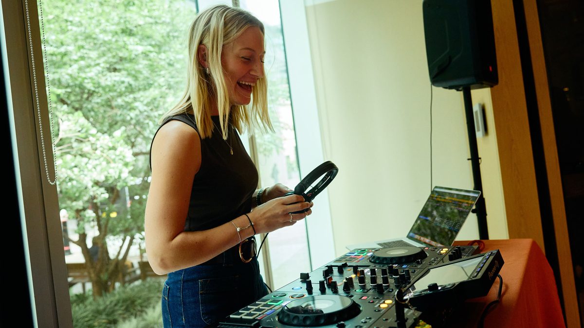 Hannah Carson DJing at LLL party