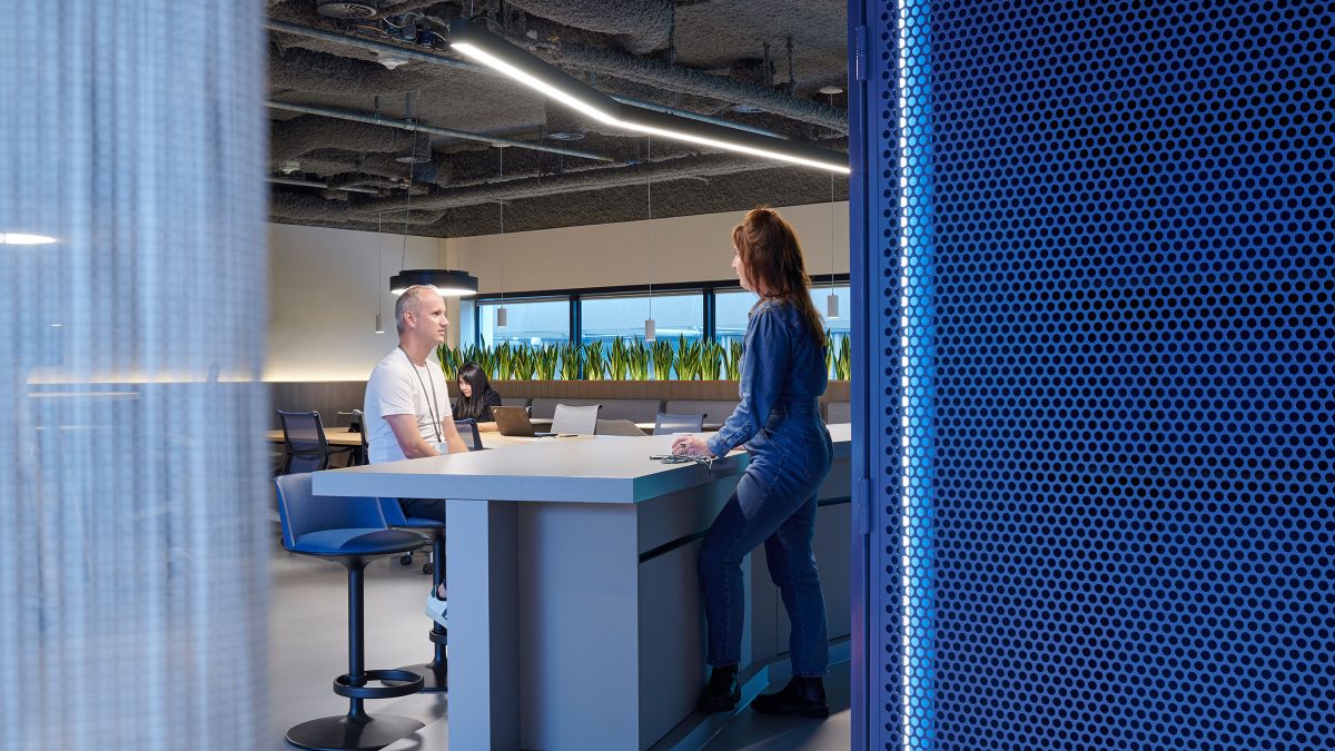 workplace-design-brand-colour-meeting-space-two-people-talking