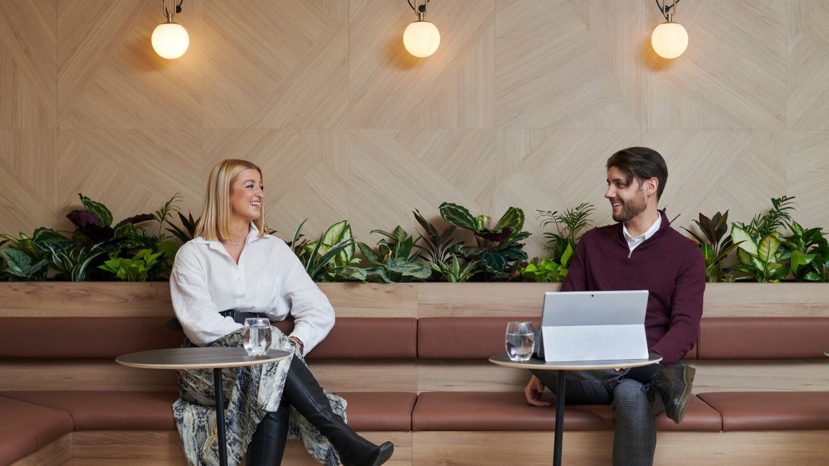two-people-chatting-within-modern-law-firm-office-design