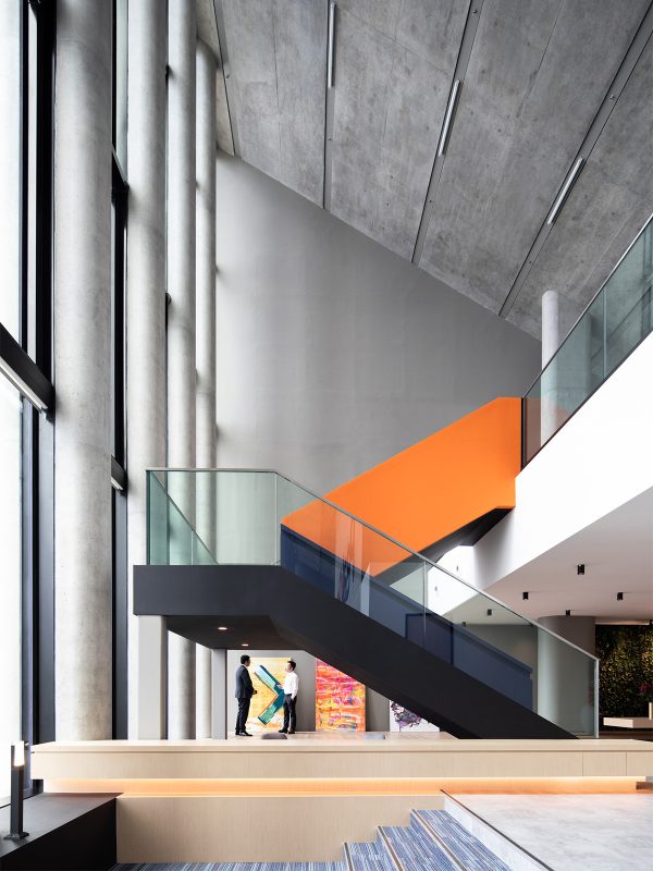 office-space-kitchen-with-tiered-seating-woman-sitting