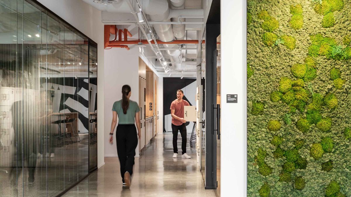 sustainable-office-design-vancouver-green-wall-coworkers-talking