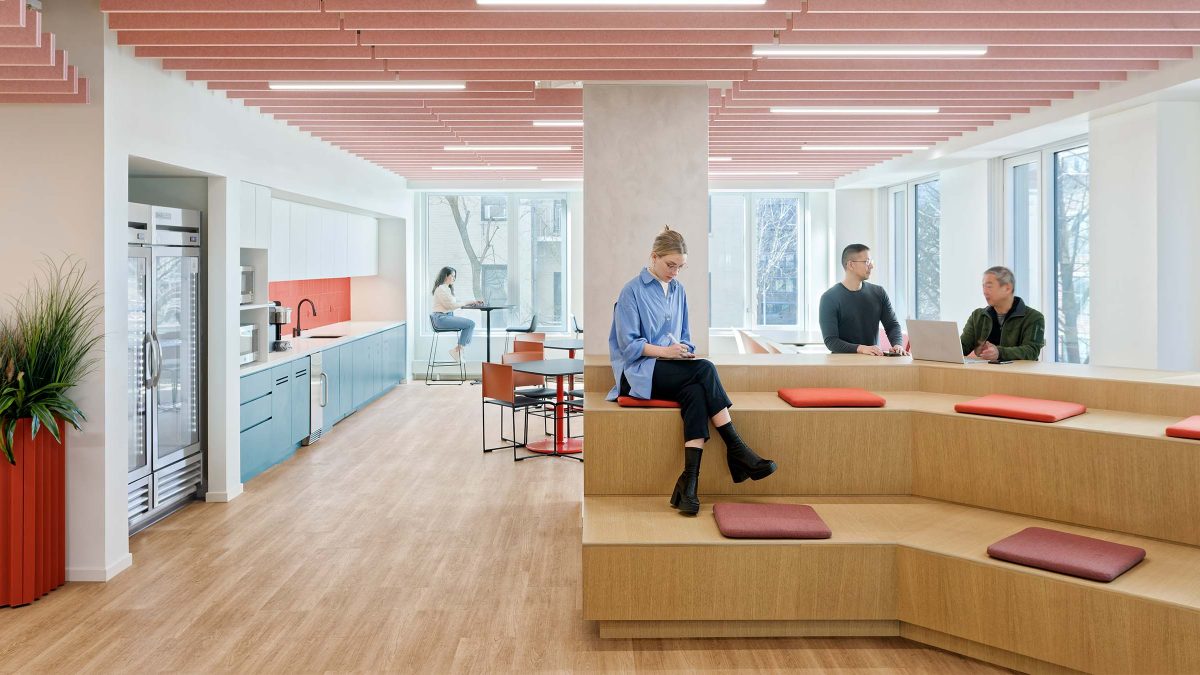 office-design-tiered-seating-in-pantry-woman-sitting