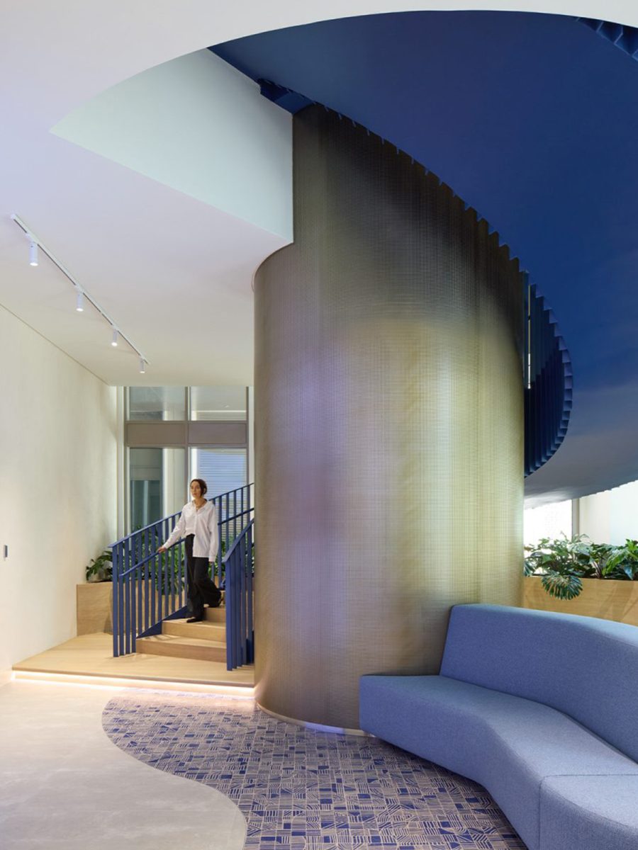 person-walking-down-blue-staircase-at-expo-city-dubai-office